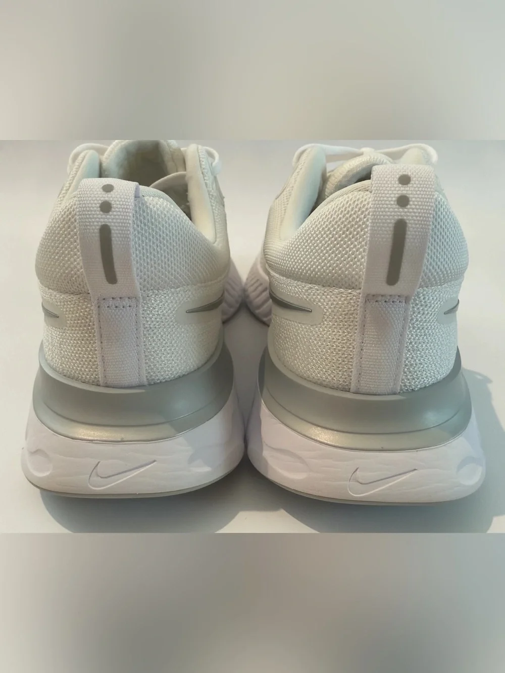 Nike Women’s React Infinity Run Flyknit 2 Sneakers in White/Silver. Size 9.5